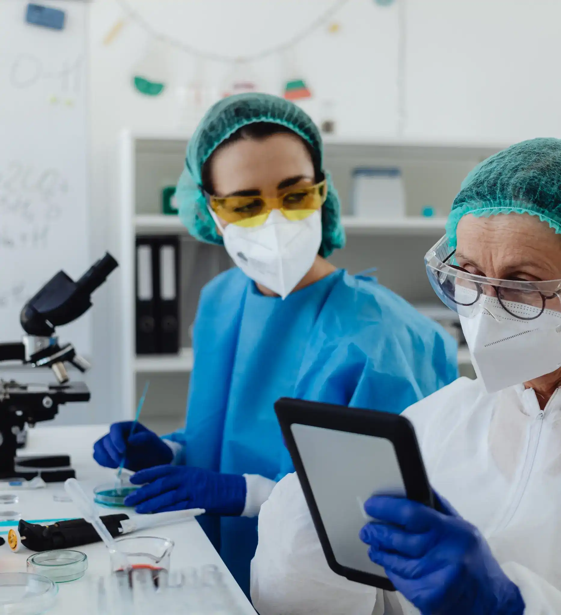 two lab technicians using a lab management software